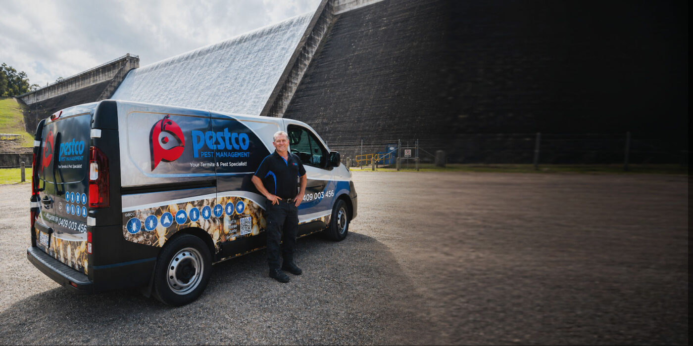 Pest Control Cairns technician with Pestco Pest Management vehicle